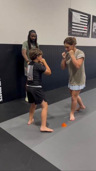 Coach Ty Stancil coaching on the mats